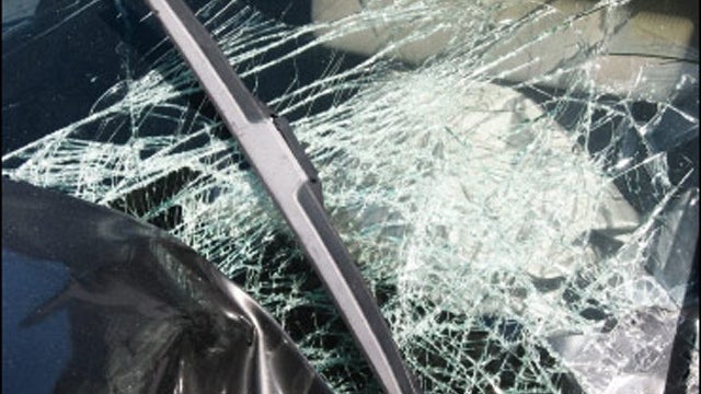 Emergency personnel respond to one of the people hit by a car, at right, during the beginning of the Hikers Parade at the Trail Days festival in Damascus, Va., May 18, 2013. 
