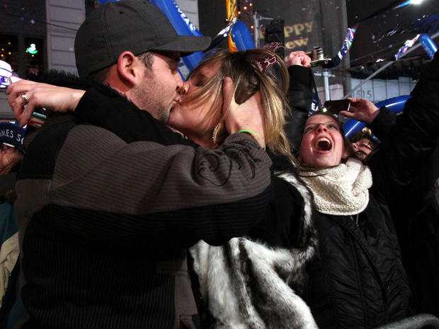 Ryan Keegan, of the Queens borough of New York, and his girlfriend Lauren Chicoine, of Bennington, N.H., share a kiss as they celebrate the new year shortly after midnight in New York's Times Square Jan. 1, 2012. 