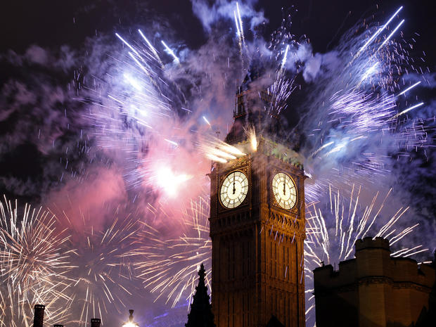 Fireworks explode over the Houses of Parliament, including St. Stephen's Tower, which holds the bell known as Big Ben, as London celebrates the arrival of New Year's Day Jan. 1, 2012. 