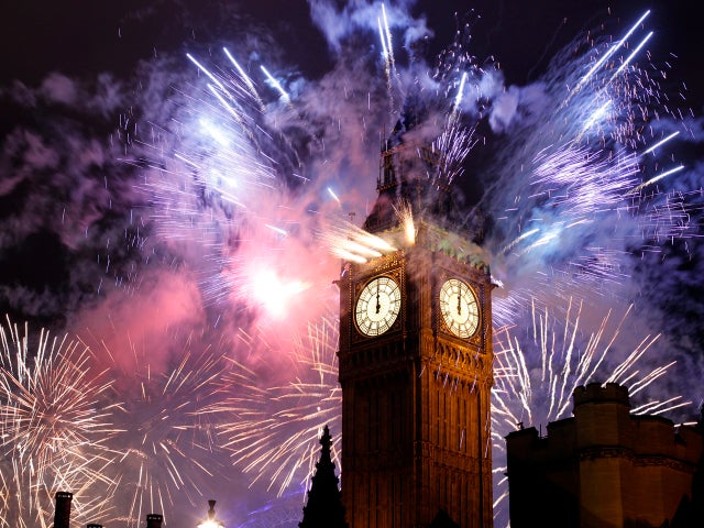 Fireworks explode over the Houses of Parliament, including St. Stephen's Tower, which holds the bell known as Big Ben, as London celebrates the arrival of New Year's Day Jan. 1, 2012. 