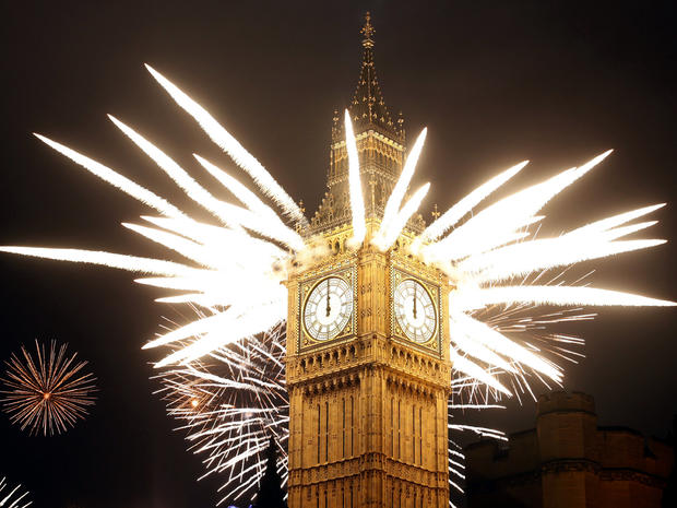 Fireworks explode over the Houses of Parliament, including St. Stephen's Tower, which holds the bell known as Big Ben, as London celebrates the arrival of New Year's Day Jan. 1, 2012. 