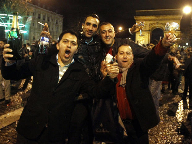 Revelers celebrate New Year's on the Champs Elysees avenue in Paris Jan. 1, 2012, in front of the Arc de Triomphe. 