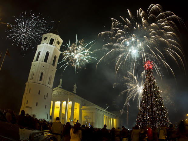 Fireworks light the sky above Cathedral Square in Vilnius, Lithuania, shortly after midnight in celebration of the New Year Jan. 1, 2012. 