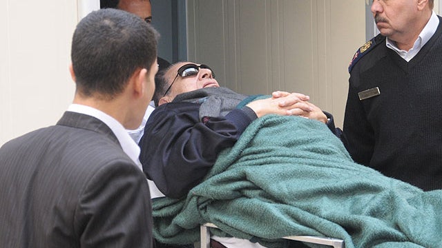 Former Egyptian president Hosni Mubarak is wheeled into a court house in Cairo, Egypt, Jan. 2, 2012.  