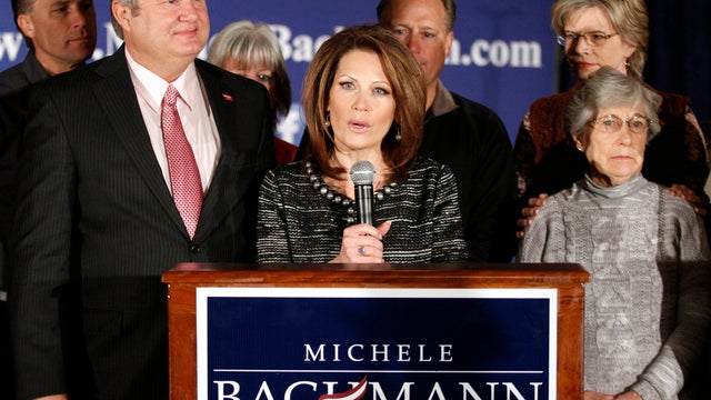 Rep. Michele Bachmann, R-Minn., joined by husband Marcus, left, family and friends, announces that she will end her campaign for president Jan. 4, 2012, in West Des Moines, Iowa. 