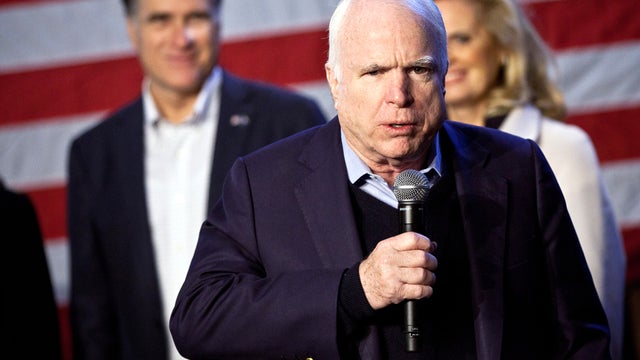 Sen. John McCain, R-Ariz., speaks during a campaign event for former Massachusetts Gov. Mitt Romney as Romney and his wife Ann Romney listen at the Peanut Warehouse Jan. 6, 2012, in Conway, S.C. 