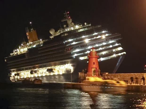 The luxury cruise ship Costa Concordia leans after it ran aground off the coast of Isola del Giglio island, Italy, gashing open the hull and forcing some 4,200 people aboard to evacuate aboard lifeboats to the nearby Isola del Giglio island, early Saturda 