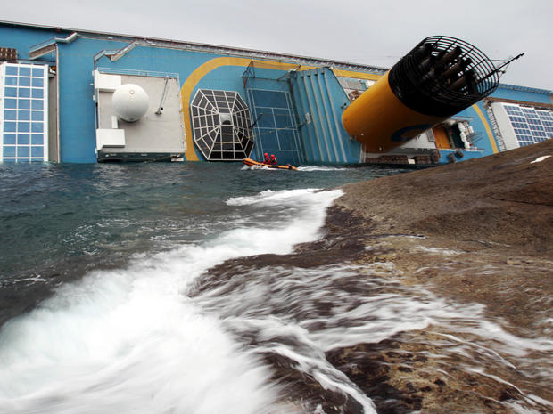 Italian rescue divers approach the Costa Concordia cruise liner two days after it ran aground off the tiny Tuscan island of Giglio, Italy, Jan. 16, 2012. The captain of the cruise liner faced accusations from authorities and passengers that he abandoned s 
