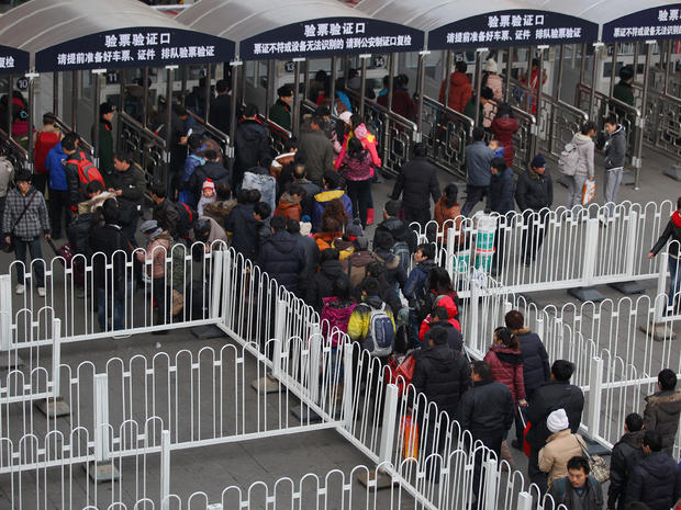 Passengers line up at Beijing West Railway Station 