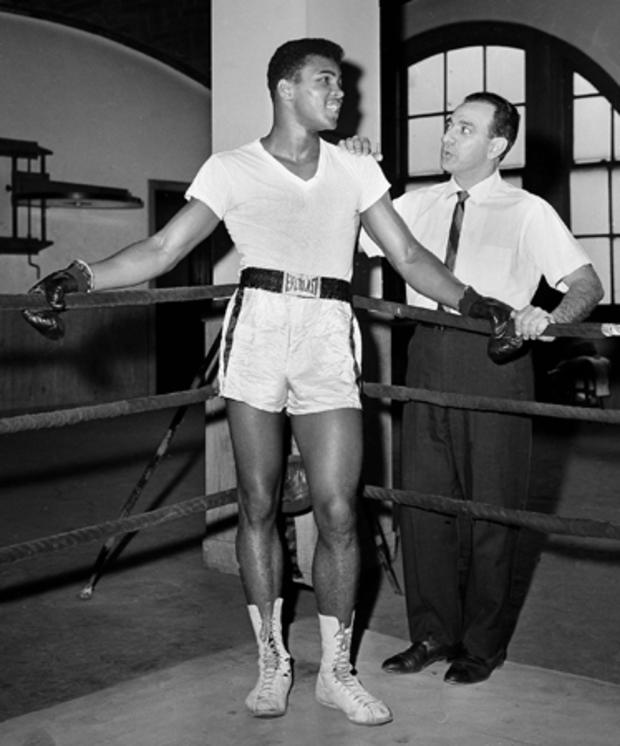 Cassius Clay is seen with his trainer Angelo Dundee 