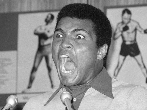 Muhammad Ali makes a face during a press luncheon 