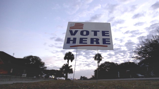 The sun rises behind a sign at a polling site Saturday, Jan. 21, 2012, in Sullivan's Island, S.C. South Carolina's primary has become a close contest between Mitt Romney, the former Massachusetts governor portraying himself as the best able to beat Presid 