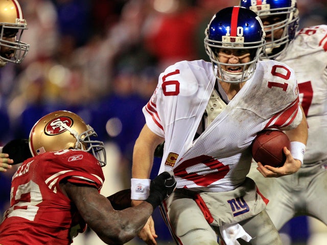 Eli Manning is sacked by Patrick Willis  