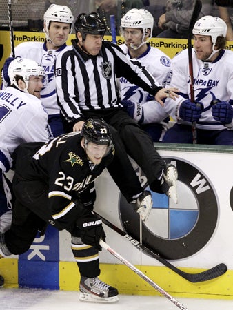Brett Connolly and Dallas Stars Tom Wandell compete for a loose puck 