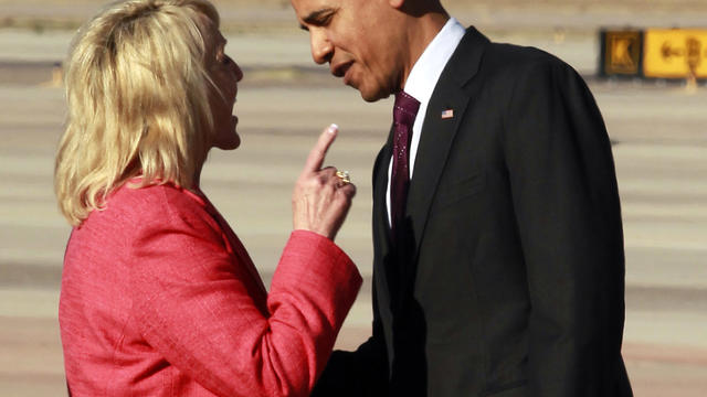 Arizona Gov. Jan Brewer points during an intense conversation with President Barack Obama after he arrived at Phoenix-Mesa Gateway Airport, Wednesday, Jan. 25, 2012, in Mesa, Ariz. Asked moments later what the conversation was about, Brewer, a Republican, 