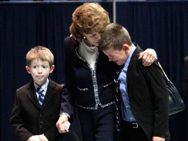 Sue Paterno, wife of former Penn State football coach Joe Paterno, consoles her grandson 