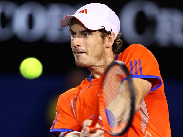 Andy Murray hits a backhand return to Novak Djokovic 