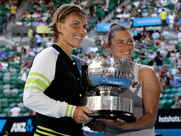 Svetlana Kuznetsova and Vera Zvonareva hold the trophy after winning their women's doubles final  