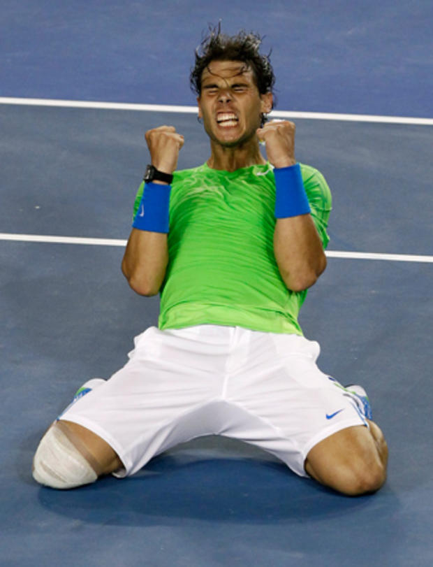 Rafael Nadal celebrates after defeating Roger Federer  