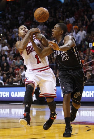 Derrick Rose loses control of the ball as he goes up for a shot  