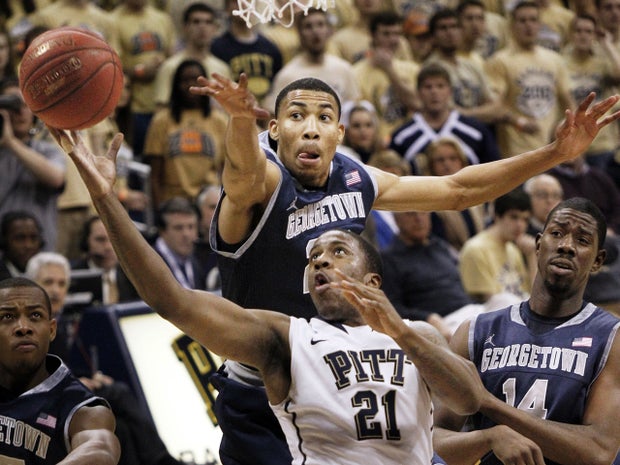 Lamar Patterson shoots in front of Otto Porter 