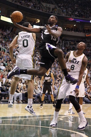 Tyreke Evans goes for a shot 
