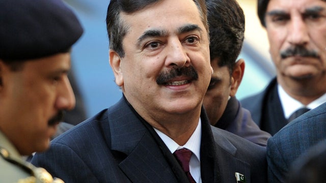 Pakistani Prime Minister Yousuf Raza Gilani, center, arrives at the Supreme Court in Islamabad Jan. 19, 2012. 