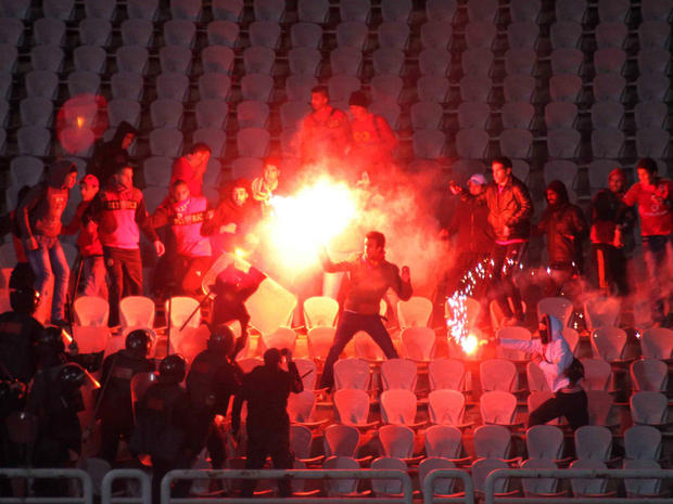 Egyptian fans clash with riot police following a soccer match in Port Said 