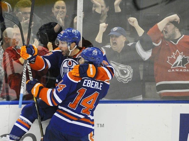 Jordan Eberle congratulates Sam Gagner on his goal  