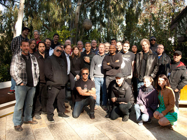 George Clooney poses with "Person to Person" producers and crew 