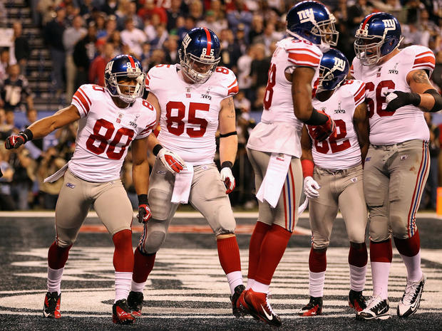 Victor Cruz celebrates with his teammates after his a two-yard touchdown  