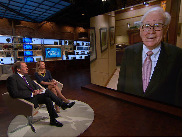 Charlie Rose and Lara Logan greet the legendary investor, Warren Buffett, in his Omaha, Neb., office 
