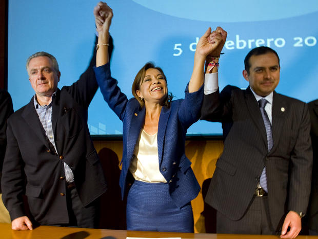 Mexican presidential candidate Josefina Vazquez Mota celebrates her victory with her counterparts Santiago Creel, left, and Ernesto Cordero from the National Action Party during a press conference in Mexico City Feb. 5, 2012. 