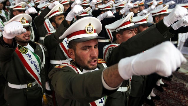 Iranian soldiers chant anti-Israeli and anti-U.S. slogans on the first day of celebrations marking the 33th anniversary of Ayatollah Ruhollah Khomeini's return from exile at Khomeini's mausoleum in Tehran, Iran, Feb. 1, 2012. 