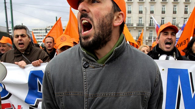 Electricity company employees of Public Power Corporation shout slogans in Athens, Greece, Feb. 9, 2012, during a protest against the Greek government's plans to privatize part of the power distribution service. 