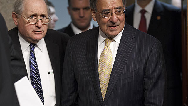 Defense Secretary Leon Panetta, joined by Senate Armed Services Committee Chairman Sen. Carl Levin, D-Mich., arrives on Capitol Hill in Washington, Feb. 14, 2012, to testify before the committee's hearing on the Pentagon's budget plan. 