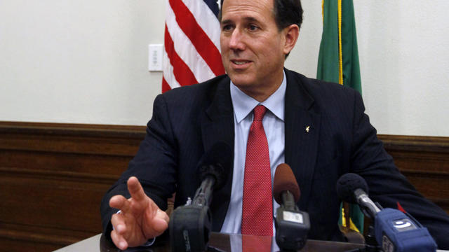 Rick Santorum answers questions at a news conference in Olympia, Wash. 