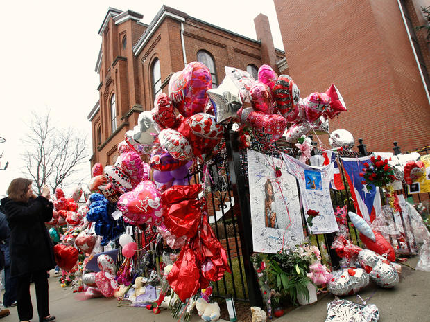 Fans mourn Whitney Houston's passing with flowers and balloons outside the Newark, NJ church where her funeral will be held. 