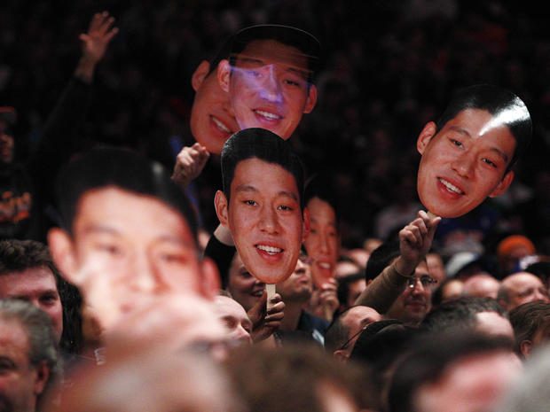 Fans hold up New York Knicks' Jeremy Lin photos 