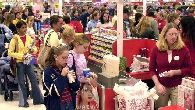 shoppers wait in check-out lines in store 