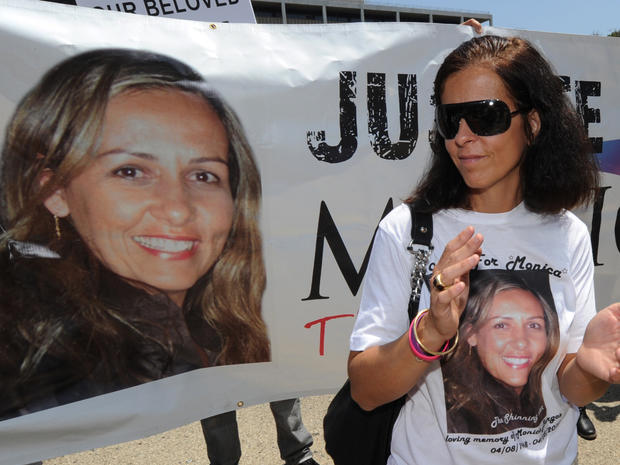Carla Burgos, the sister of murdered woman Monica Beresford-Redman, protests with fothers about delays in the extradition of suspect, reality TV show producer Bruce Beresford-Redman 