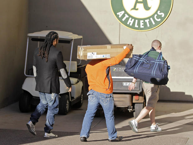 Manny Ramirez has his bags carried as he arrives at the teams spring training facility 