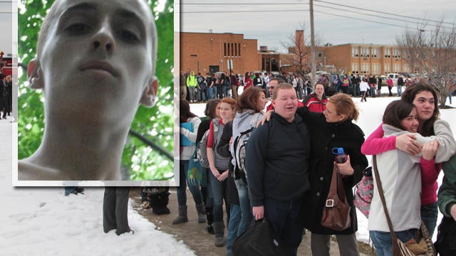 Chardon High School students file out of the high school, at rear, following shooting in Chardon, Ohio. Suspect TJ Lane is seen in inset. 