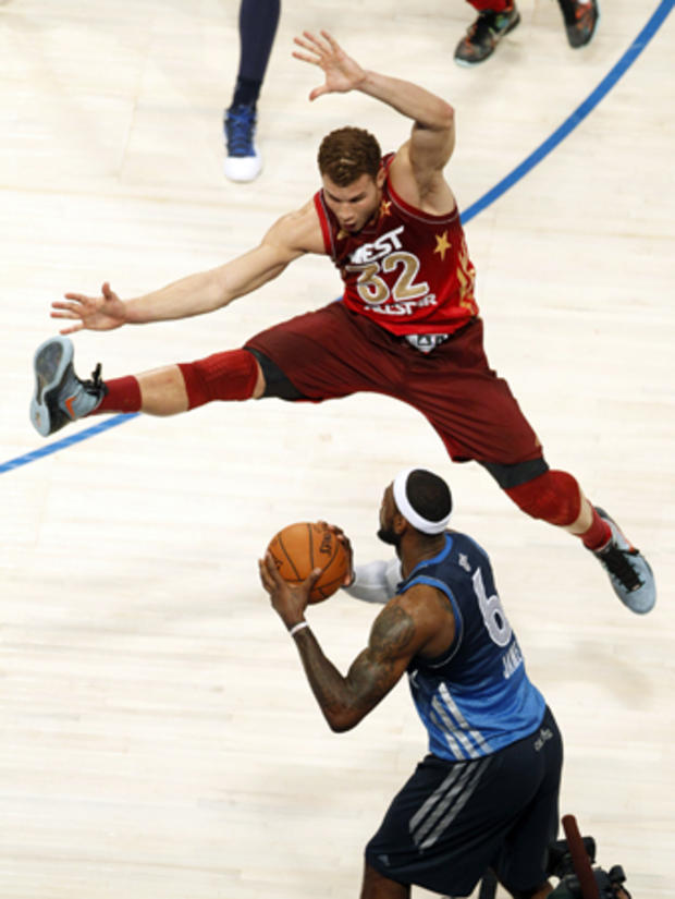 Blake Griffin jumps to block a pass by LeBron James 