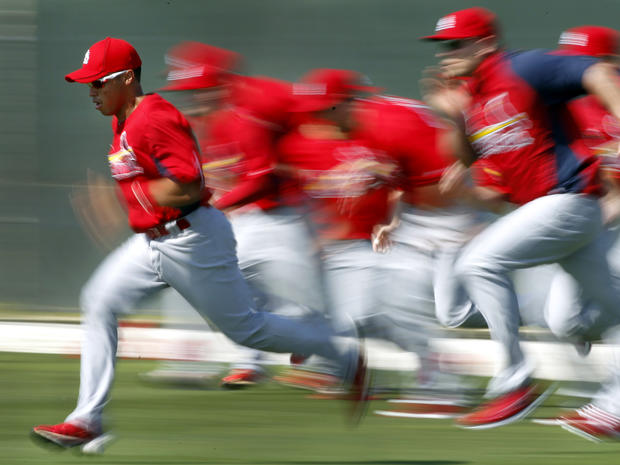 Kolten Wong leads his teammates in a sprint  