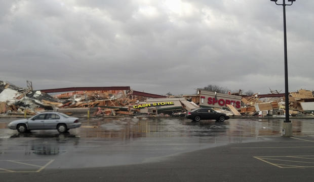 damage is seen to a strip mall in Harrisburg, Ill. 