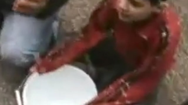 Young resident of Baba Amr, Homs, collects snow to melt as drinking water 