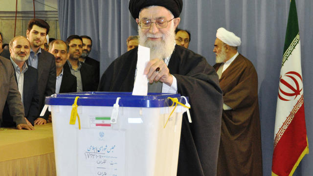 Iranian leader Ayatollah Ali Khamenei casts a ballot  