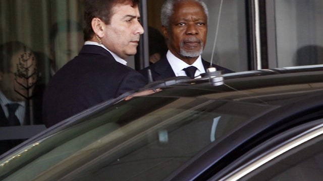 Kofi Annan, the United Nations special envoy to Syria, right, leaves Four Seasons Hotel in Damascus Saturday on way to presidential palace for meeting with Syrian President Bashar Assad 