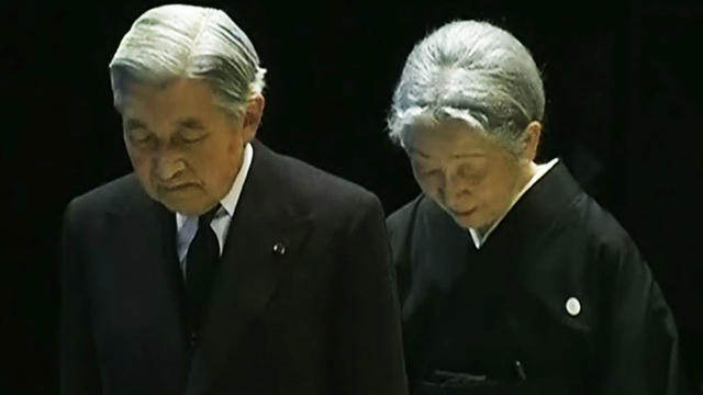 Japanese mourners relive the pain of a year ago 